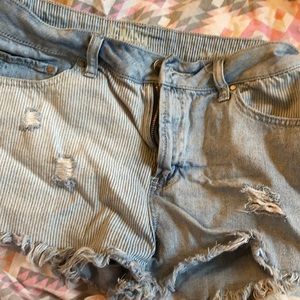 Mid rise distressed denim shorts